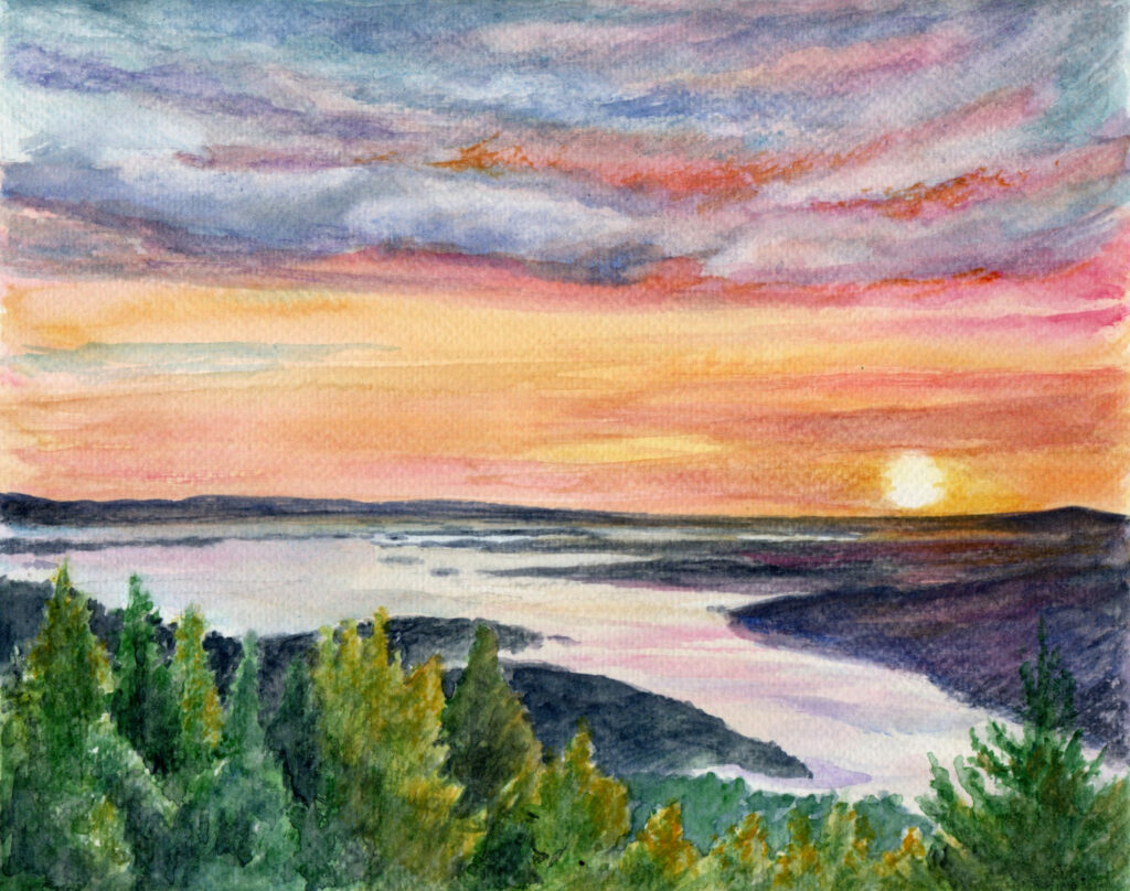 sunset over water and mountain