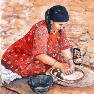 Woman from Morocco making bread