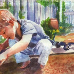 Little boy working in the garden